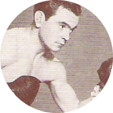 A vintage portrait of Dave Crowley with his boxing gloves on.
