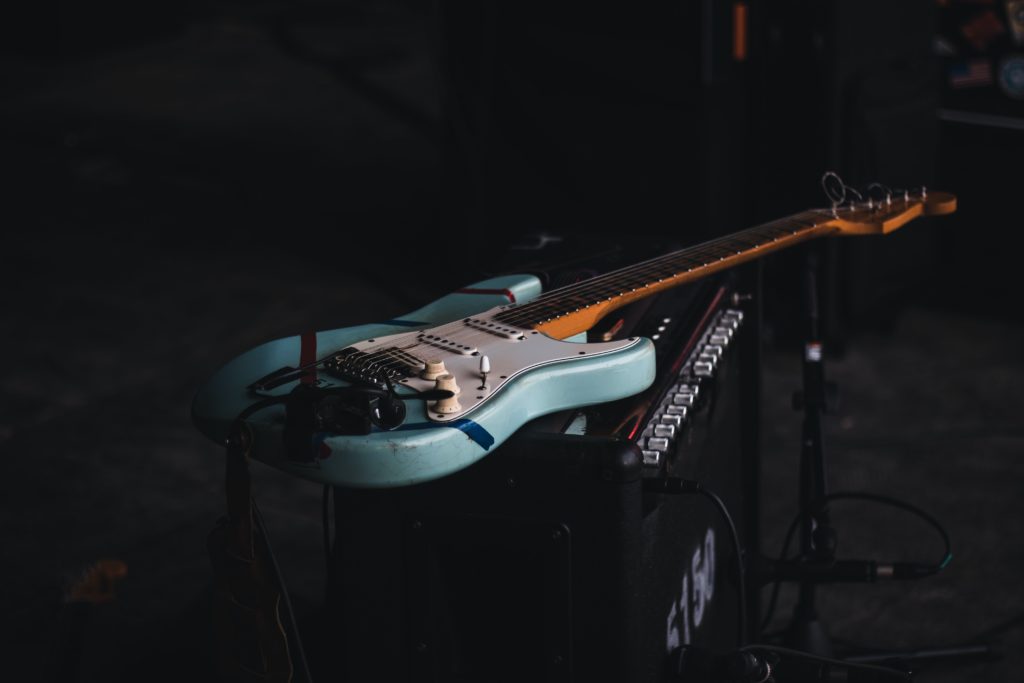 A blue guitar is sitting on a amp in Hornsey Sounds.